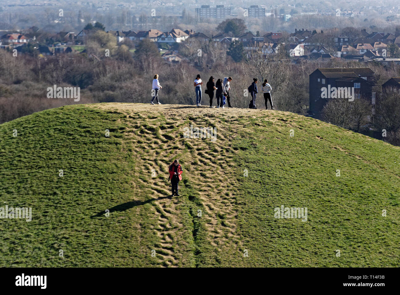 People viewing the City Of London in the distance from the top of a mound in Northala fields Park, Northolt, middlesex Stock Photo