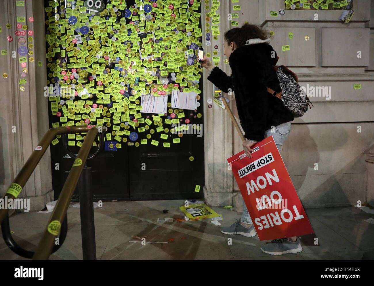 Stickers on the Cabinet Office door on Whitehall left by anti-Brexit campaigners after they took part in the People's Vote March in London. Stock Photo