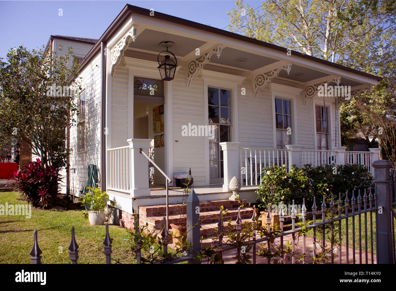 Fully renovated shotgun-style home in Uptown New Orleans, with camel-back addition. Stock Photo