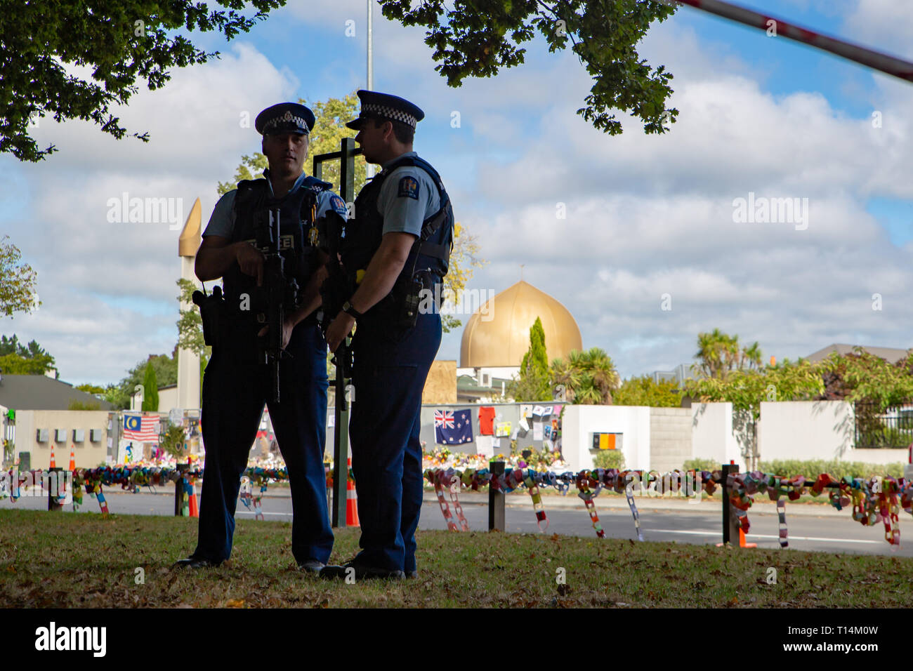 Christchurch, New Zealand, March 22 2019: Policeman silhouetted in front of the Masij El Noor as they stand guard at the Memorial Service to remember Stock Photo