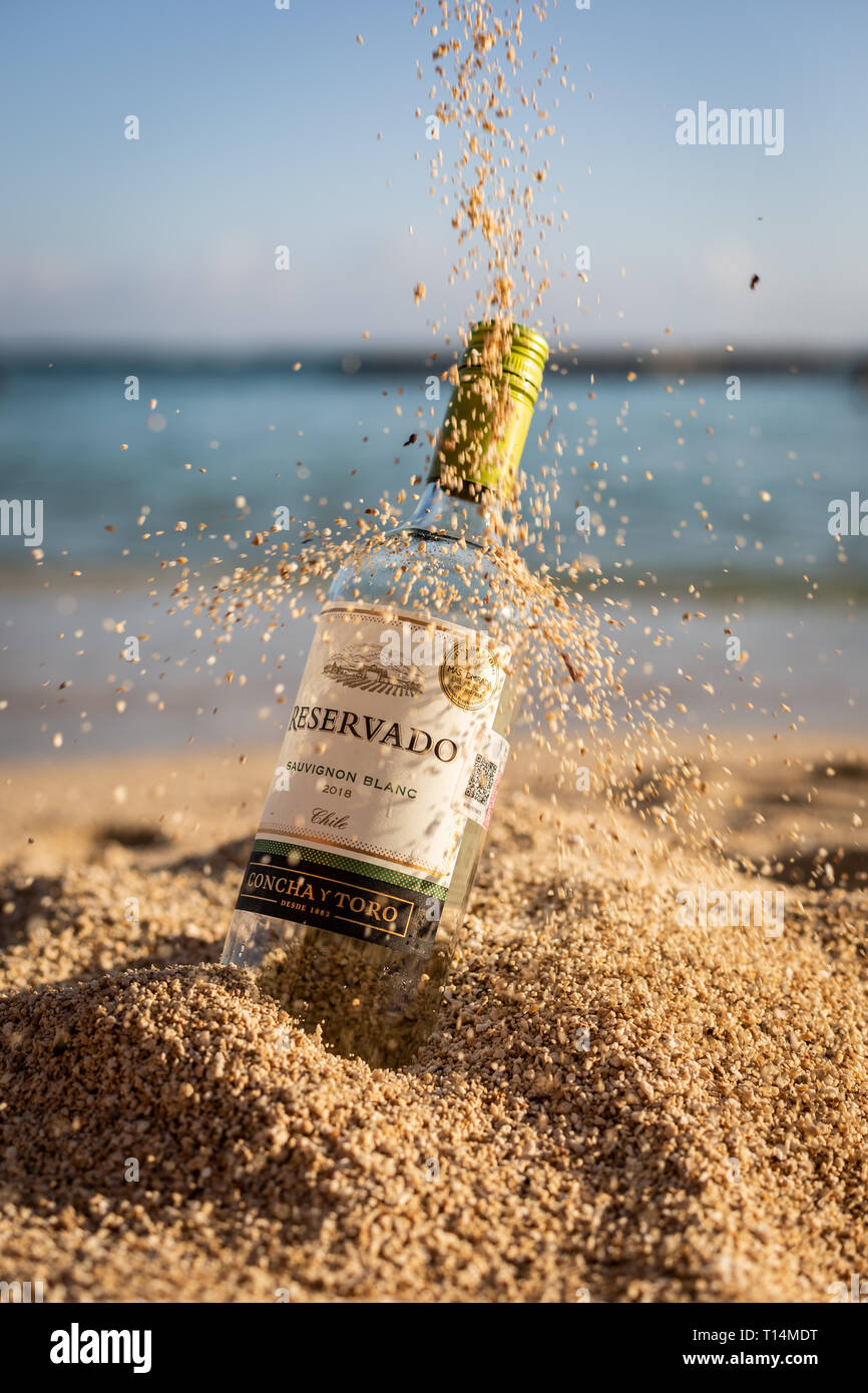 wine bottle on sand Stock Photo - Alamy