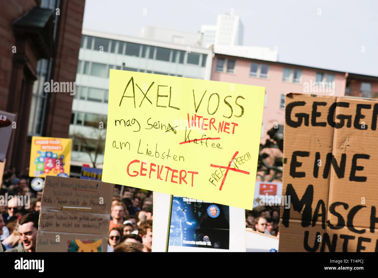 Frankfurt, Germany. 23rd Mar, 2019. A protester holds up a sign that reads 'Axel Voss likes his Internet filtered'. Axel Voss is a MEP (Member of the European Parliament) and one of the politicians who drafted the new Internet law. More than 15,000 protesters marched through Frankfurt calling for the Internet to remain free and to not to pass the new EU Copyright Directive into law. The protest was part of a Germany wide day of protest against the EU directive. Credit: Michael Debets/Pacific Press/Alamy Live News Stock Photo