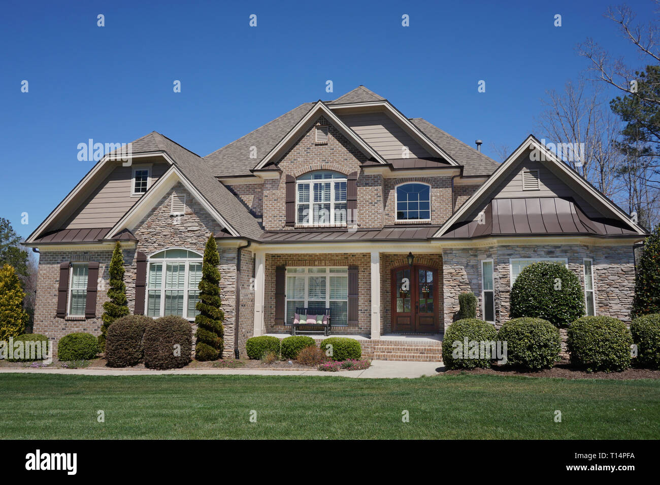 Suburban Home With A Stone And Brick Exterior Stock Photo Alamy