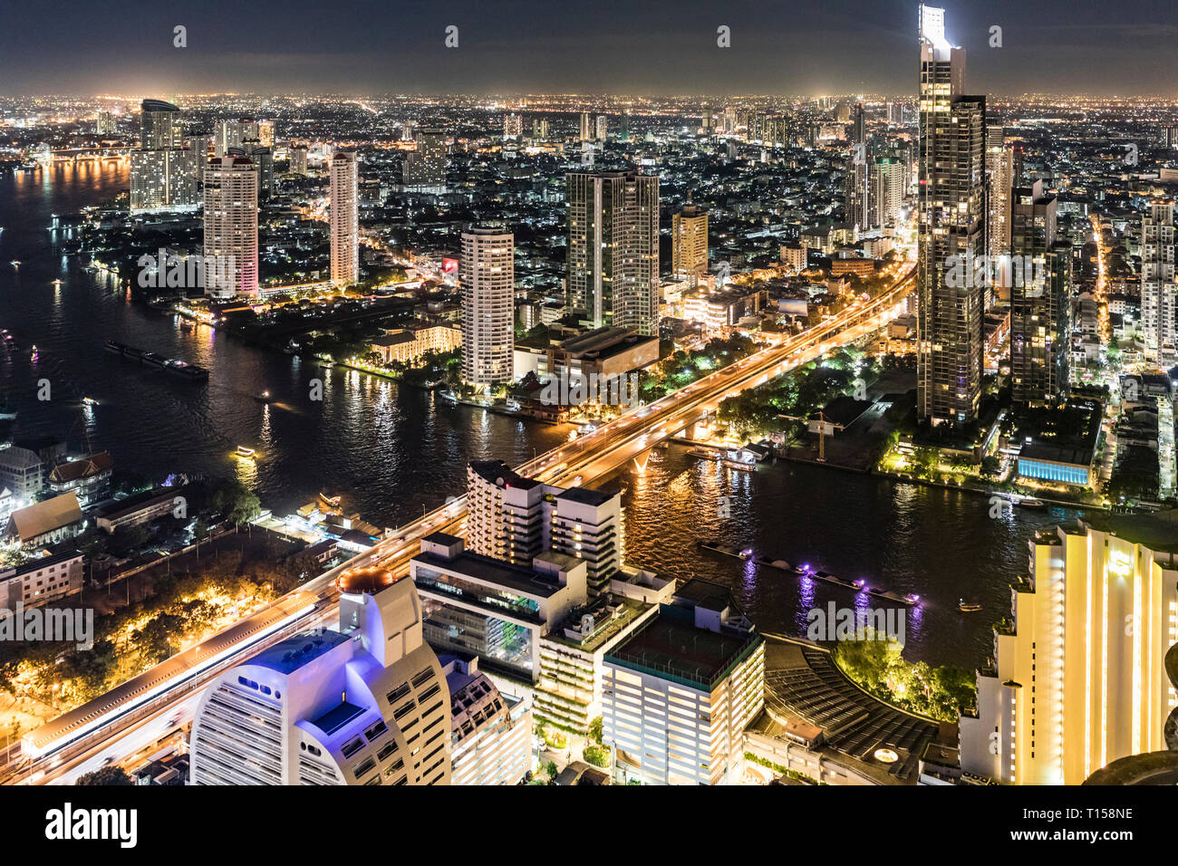 Thailand, Bangkok, aerial view of the city with Chao Phraya river at night Stock Photo