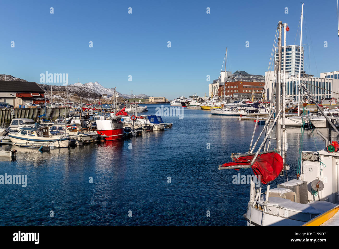 The port town of Bodo in Norway, showing many small boats anchored in the harbour. Stock Photo
