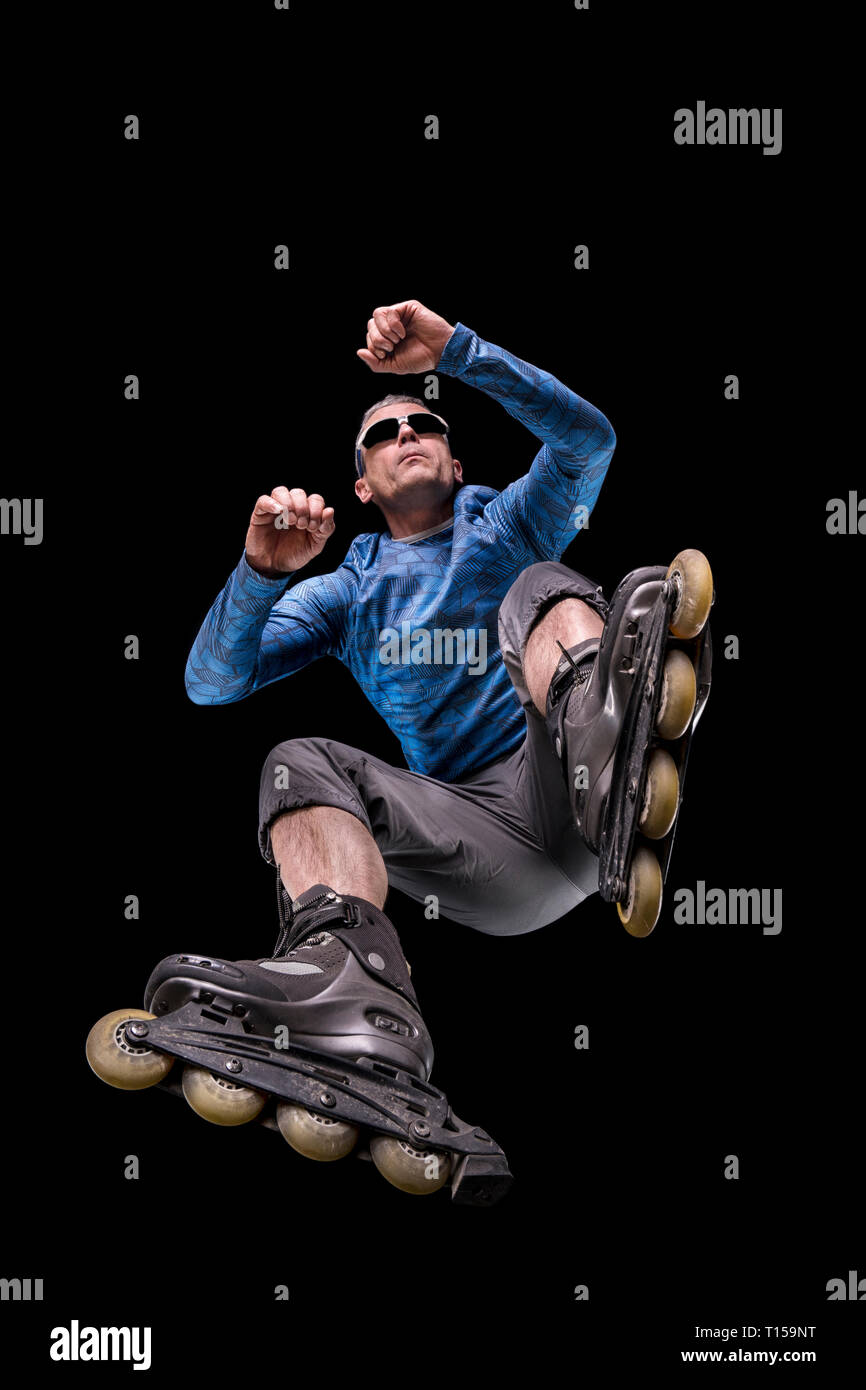Inlineskater against black background seen from below Stock Photo Alamy