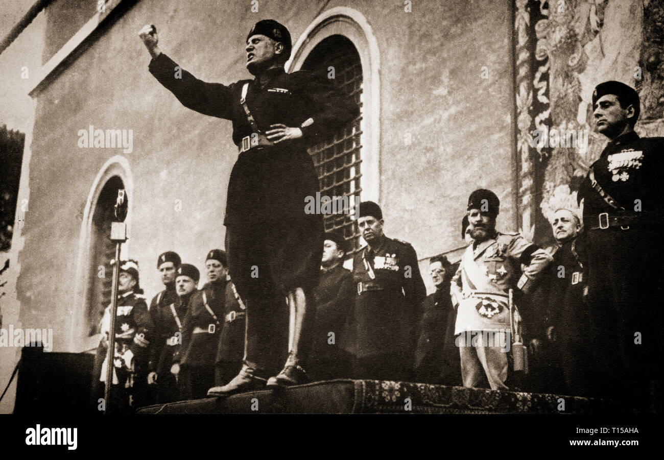 A speech from Benito Mussolini (1883- 1945), Italian politician and journalist who became leader of the National Fascist Party. In October 1922, Mussolini became the youngest Prime Minister in Italian history, removed all political opposition through his secret police. He and his followers consolidated their power through a series of laws that transformed the nation into a one-party dictatorship. Within five years, Mussolini had established dictatorial authority by both legal and extraordinary means and aspired to create a totalitarian state. After the Abyssinia Crisis of 1935–1936, Mussolini  Stock Photo