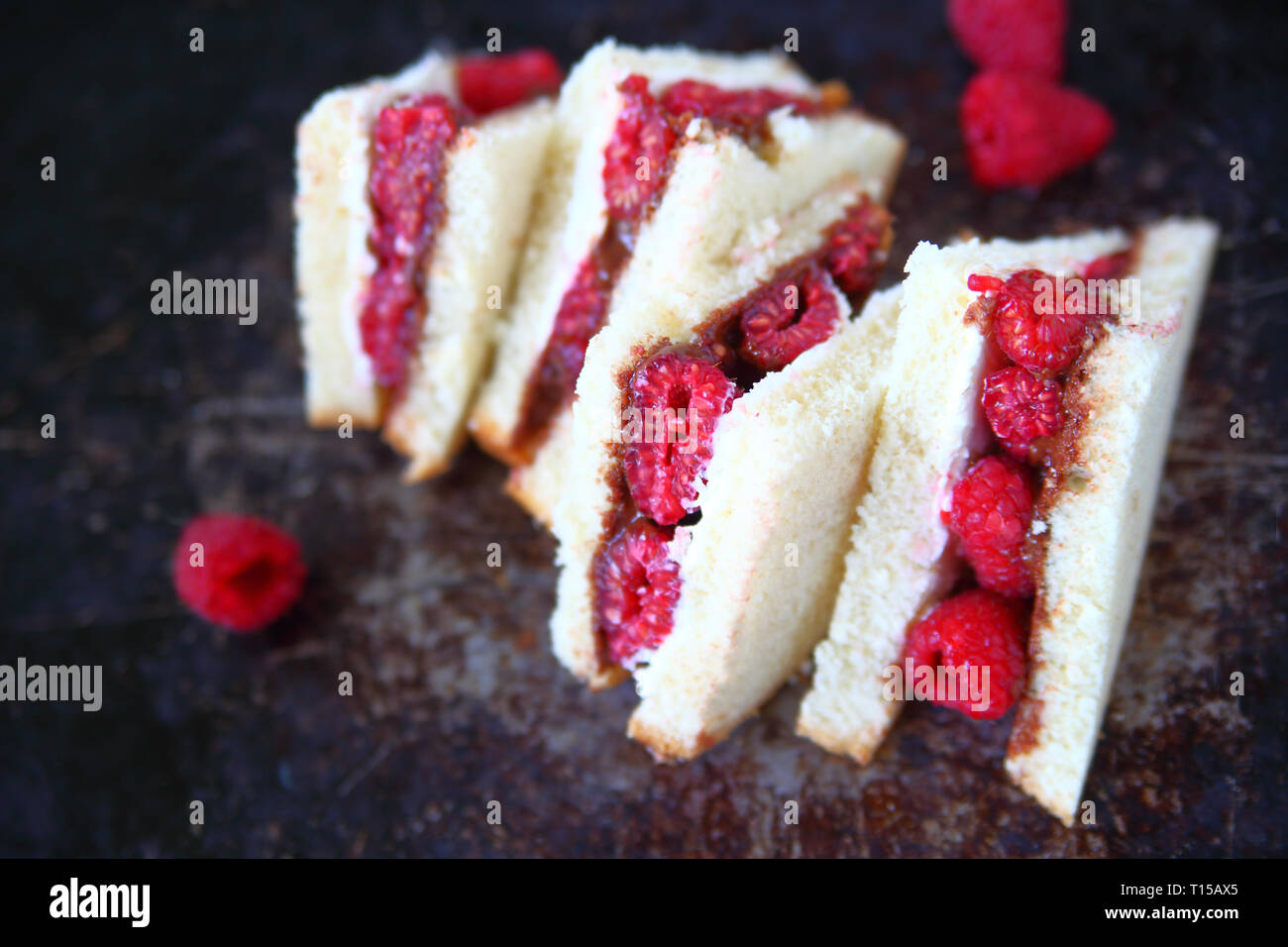 Fresh raspberries, chocolate hazelnut spread and cream cheese on white ...