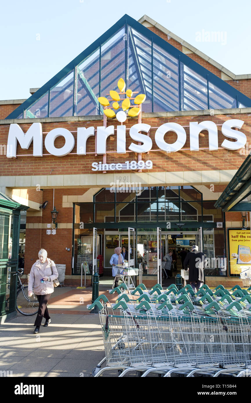 London, UK - February 25, 2019. Shoppers outside the front of a Morrisons supermarket in Hatch End, London Stock Photo