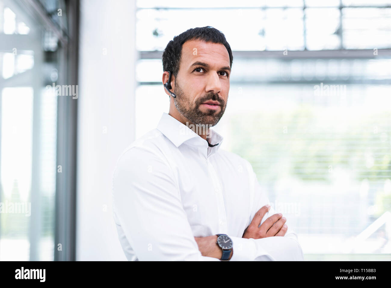 Businessman using headset Stock Photo
