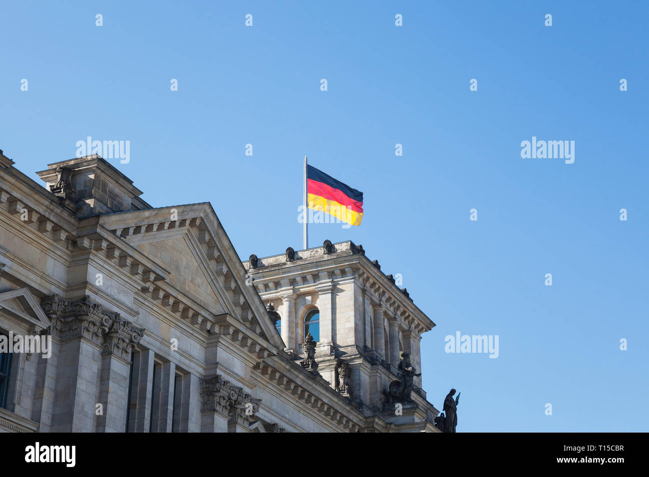 Germany, Berlin, Reichstag building and German flag Stock Photo