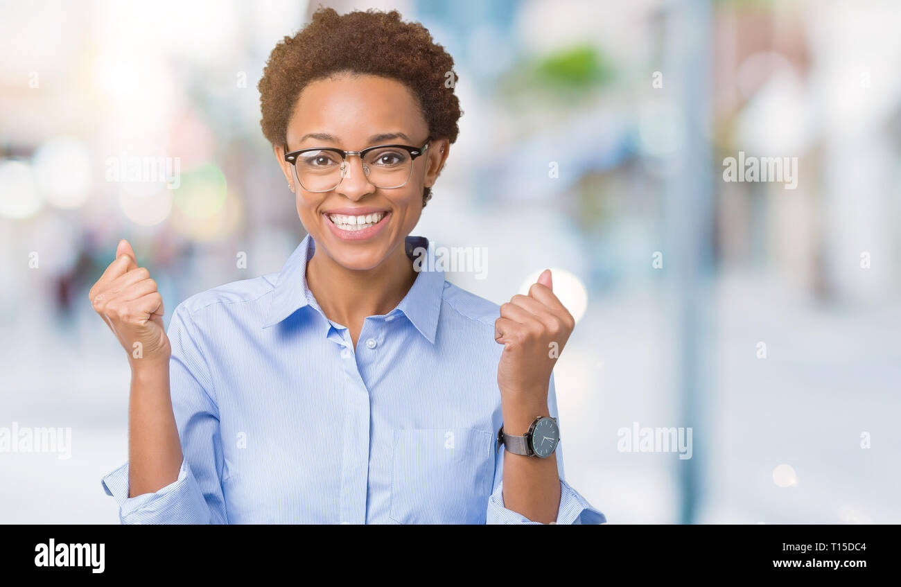 Young beautiful african american business woman over isolated ...