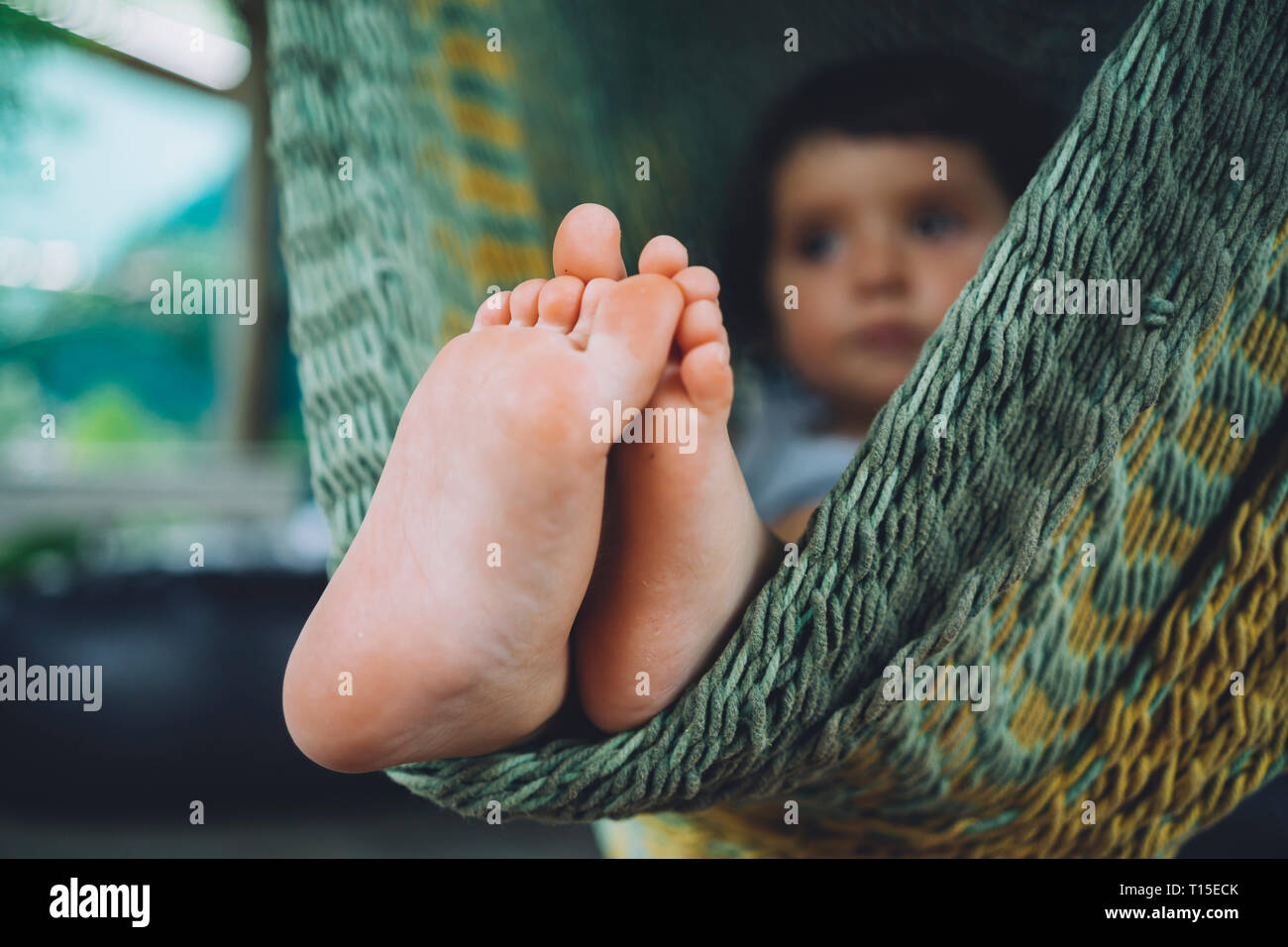 Little girl feet up hires stock photography and images Alamy