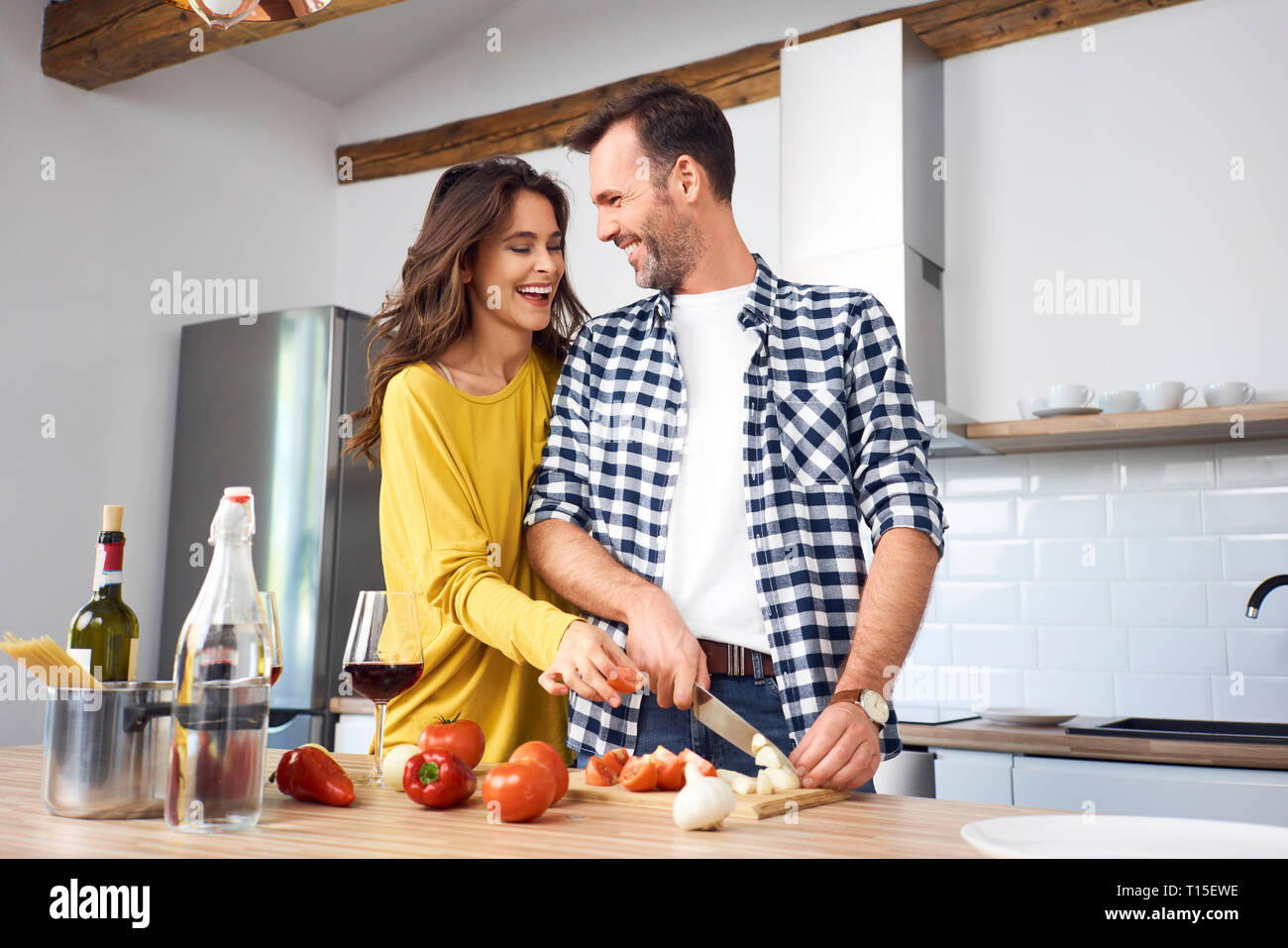 Affectionate couple in kitchen, preparing spaghetti toghether Stock ...