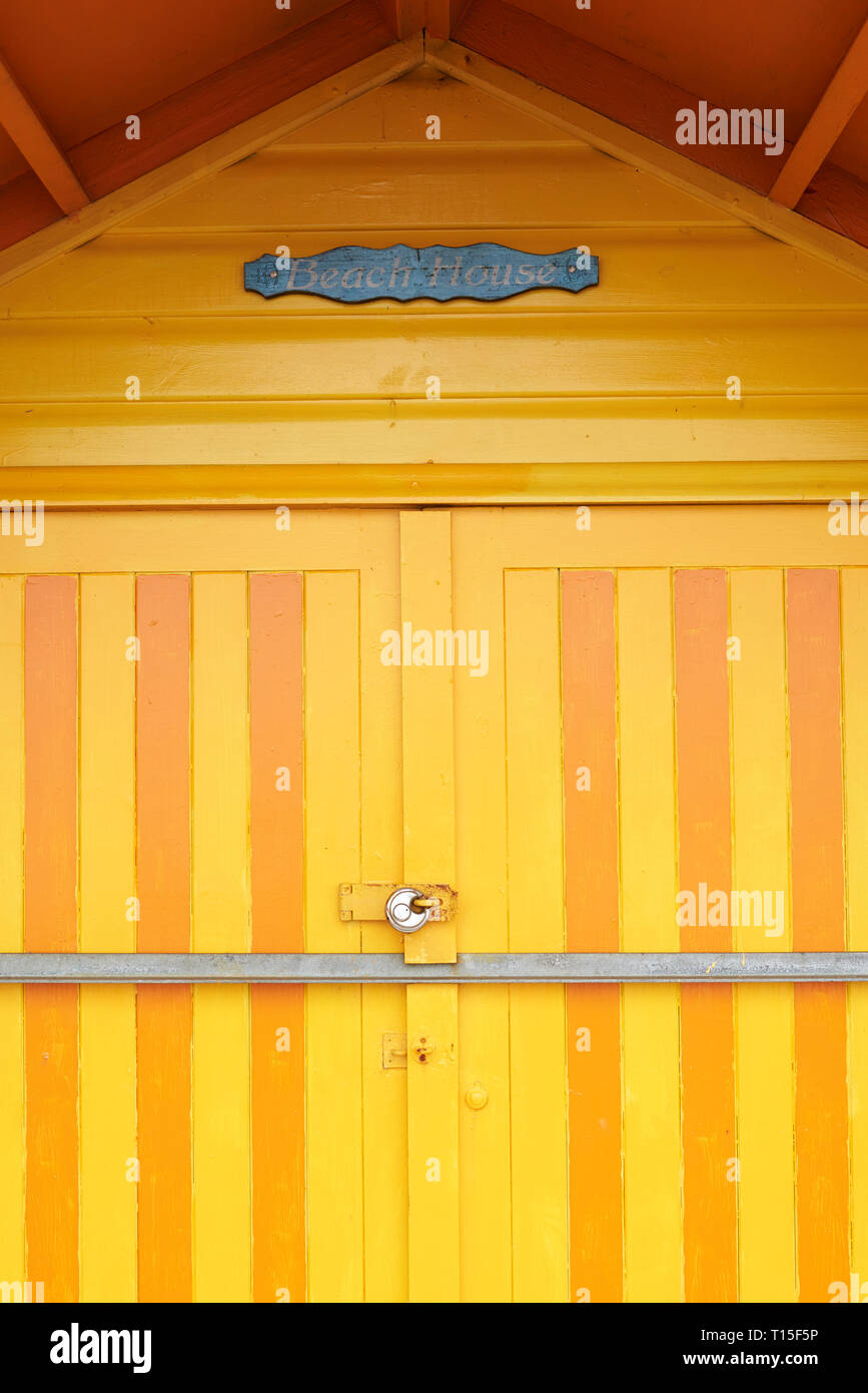 Colorful yellow door of a beach house Stock Photo