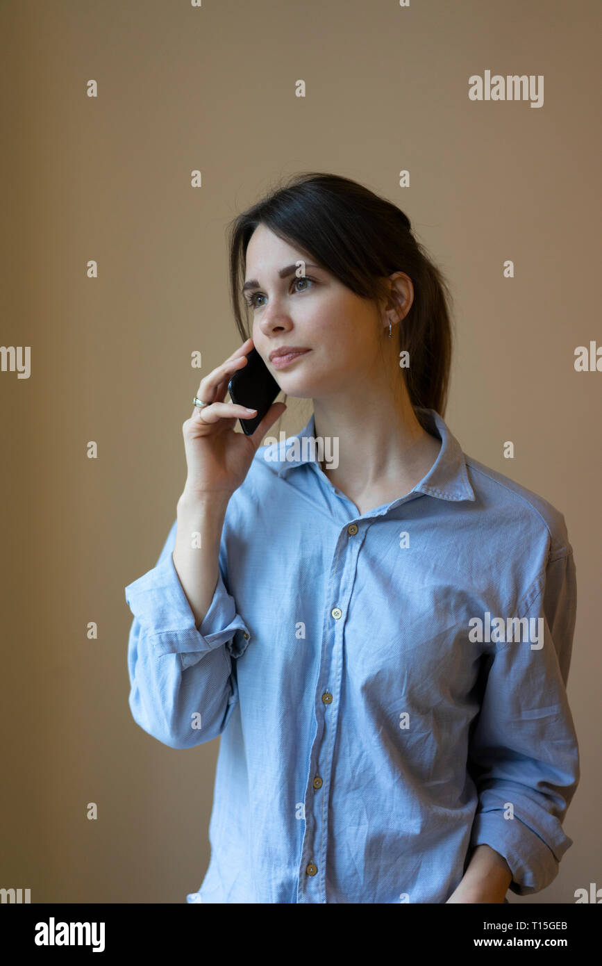 Young woman talking on the phone Stock Photo