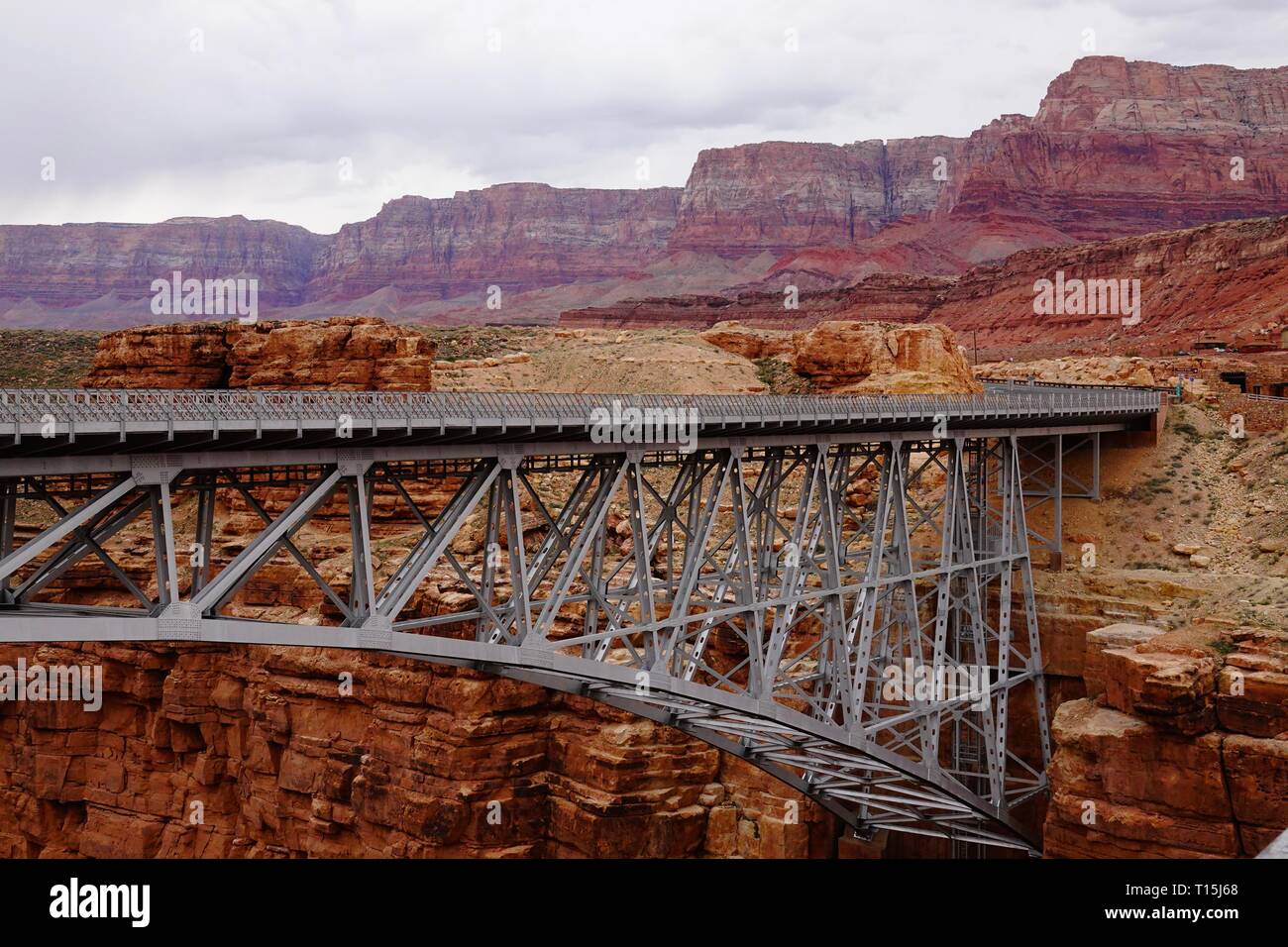 Navajo Bridge is a pair of steel spandrel arch bridges that cross the Colorado River near Lee's Ferry in Arizona. Stock Photo
