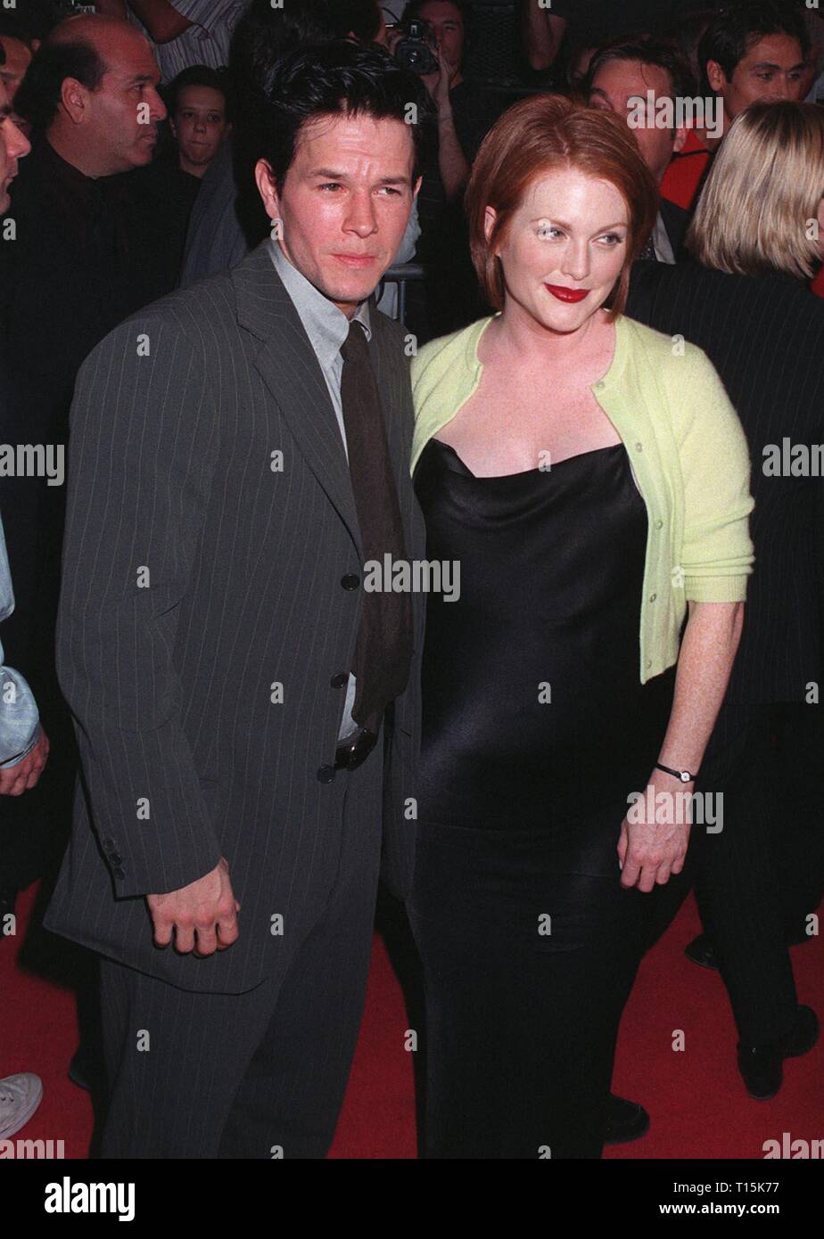 LOS ANGELES, CA. October 15, 1997: Actor Mark Wahlberg & actress Julianne Moore at the premiere of their new movie, 'Boogie Nights.' The movie is about a family of actors & filmmakers in the adult movie business. Stock Photo