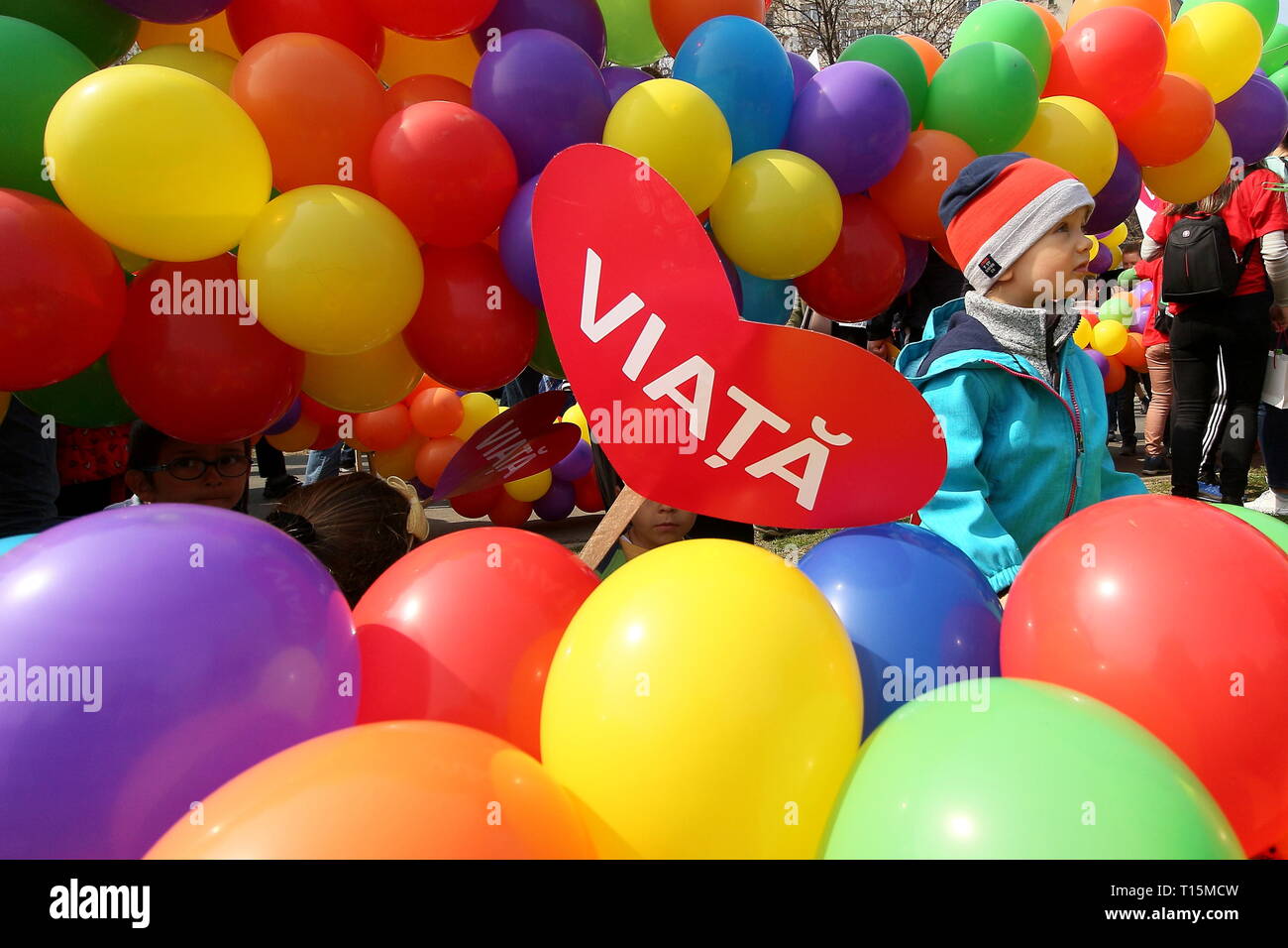 Bucharest, Romania. 23rd Mar, 2019. Bucharest, Romania - March 23, 2019: Children play between colorful balloons at the 'March for Life - Unique from first second', a rally organized in order to protect the right to life of unborn children, in Bucharest. Credit: lcv/Alamy Live News Stock Photo