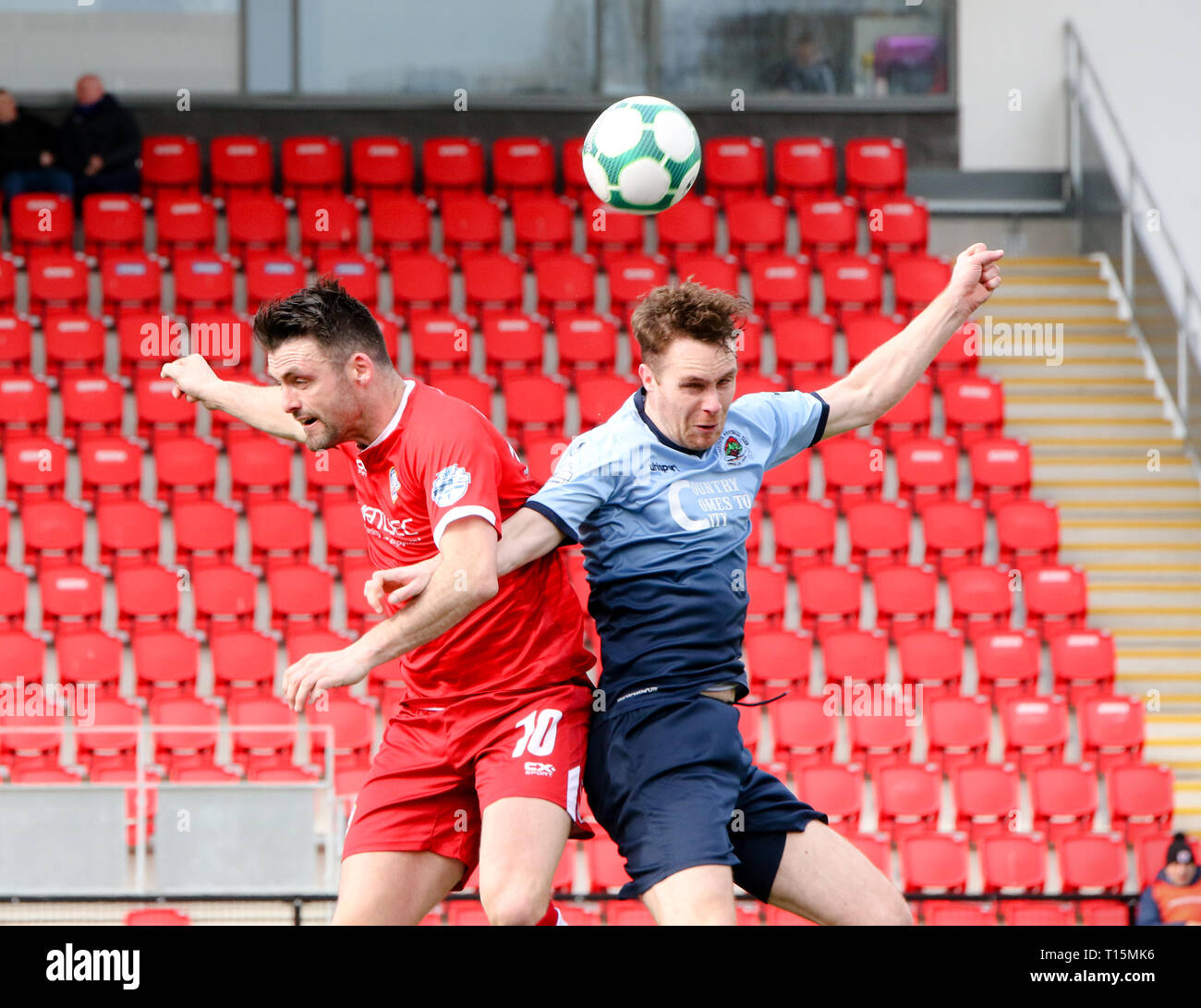 Derry, Northern Ireland, UK. Eoin Bradley (Coleraine) & Colm McLaughlin (Institute) an an ariel dual during the Danske Bank Premiership fixture between Institute FC & Coleraine FC at the Ryan McBride Brandywell Stadium 23-03-2019 Credit: Kevin Moore/mci/Alamy Live News Stock Photo