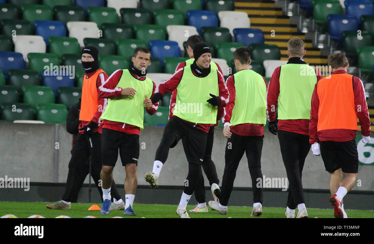 Windsor Park Belfast, Northern Ireland, UK. 23 March 2019. The Belarus squad train at Windsor Park before their game against Northern Ireland tomorrow night. In background Aleksandr Hleb training (hat and snood). Credit: David Hunter/Alamy Live News.. Stock Photo