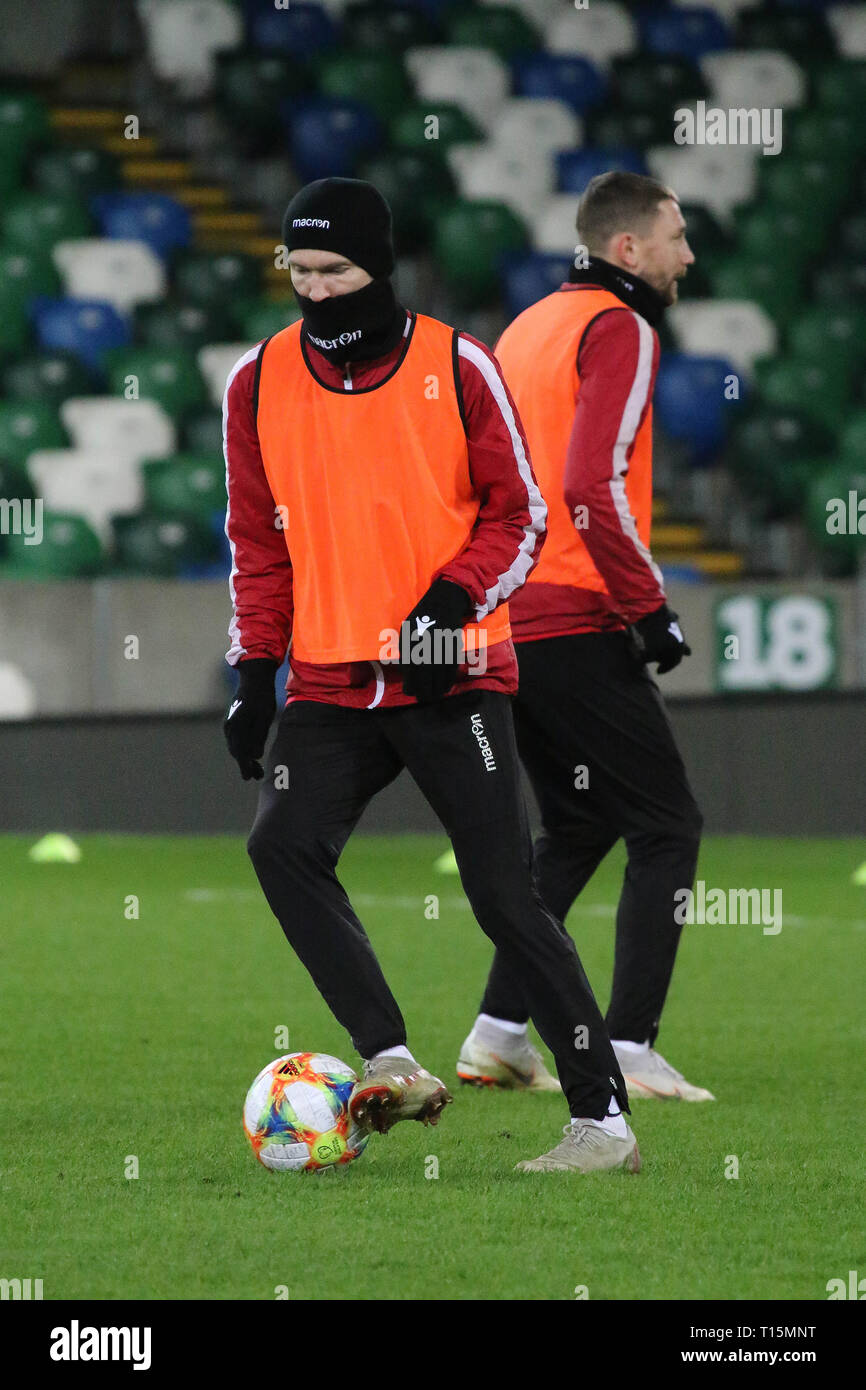 Windsor Park Belfast, Northern Ireland, UK. 23 March 2019. The Belarus squad train at Windsor Park before their game against Northern Ireland tomorrow night. Alexander Hleb training (hat and snood). Credit: David Hunter/Alamy Live News.. Stock Photo