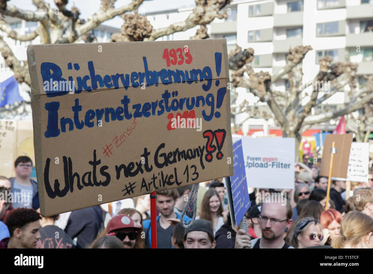Frankfurt, Germany. 23rd March 2019. A protester holds up a sign that reads '1933 Book burning - 2019 Destruction of the Internet - What's next Germany?!'. More than 15,000 protesters marched through Frankfurt calling for the Internet to remain free and to not to pass the new EU Copyright Directive into law. The protest was part of a Germany wide day of protest against the EU directive. Stock Photo