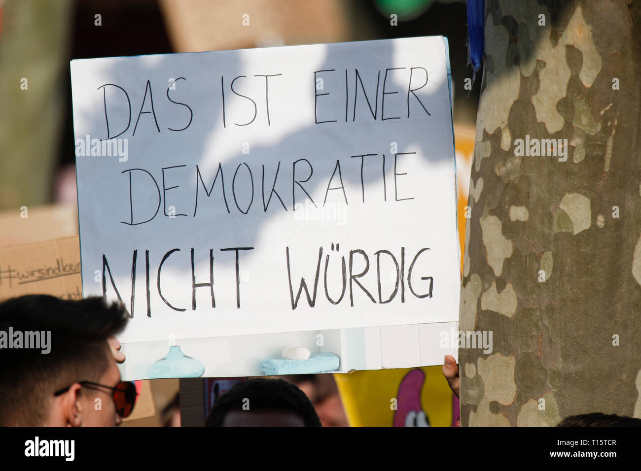 Frankfurt, Germany. 23rd March 2019. A protester holds up a sign that reads 'That's not worthy of a democracy'. More than 15,000 protesters marched through Frankfurt calling for the Internet to remain free and to not to pass the new EU Copyright Directive into law. The protest was part of a Germany wide day of protest against the EU directive. Stock Photo