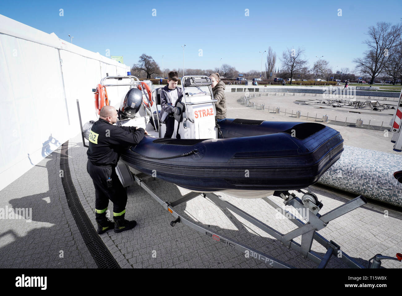 Warsaw, Poland. 23rd Mar, 2019. A boy handles the steering wheel of a fire department rescue boat during the Water Day Picnic in Warsaw, Poland, on March 23, 2019. The picnic was held at the Multimedia Fountain Park on the occasion of International Water Day. Credit: Jaap Arriens/Xinhua/Alamy Live News Stock Photo