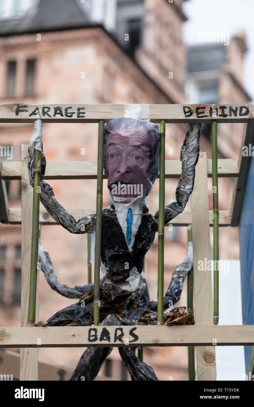 London, UK. 23rd Mar, 2019. Peoples Vote March, Farage behind bars placard. Crowd detail and banners as taken from the perspective of a protester. Remain banners, second referendum. Credit: Tony Pincham/Alamy Live News Stock Photo
