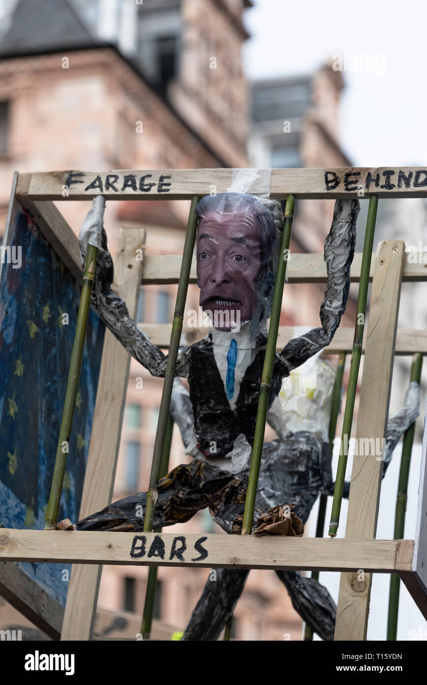 London, UK. 23rd Mar, 2019. Peoples Vote March, Farage behind bars placard. Crowd detail and banners as taken from the perspective of a protester. Remain banners, second referendum. Credit: Tony Pincham/Alamy Live News Stock Photo