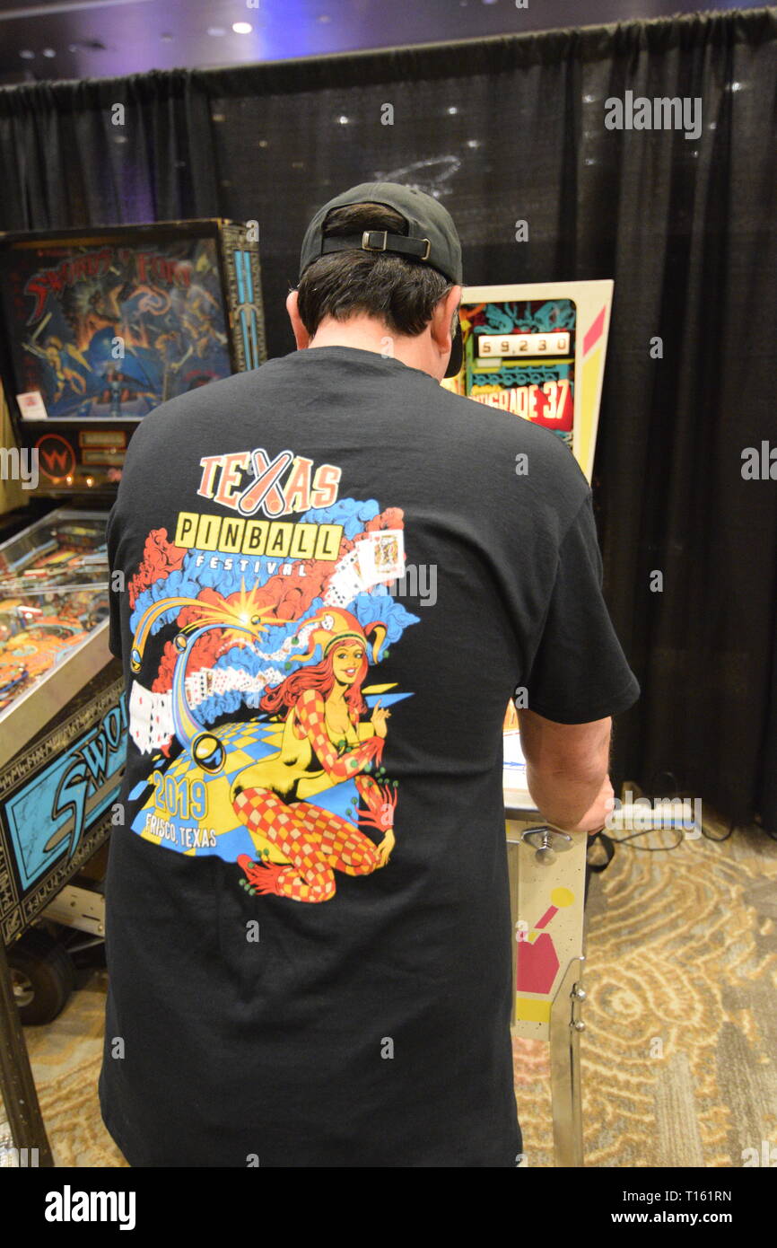 Frisco, USA. 23rd March, 2019.  Pinball enthusiast playing the Centigrade 37 pinball machine at the Texas Pinball Festival at the Embassy Suites Dallas – Frisco Hotel and Convention Center. Credit: Mariana Fernandez/Alamy Live News Stock Photo