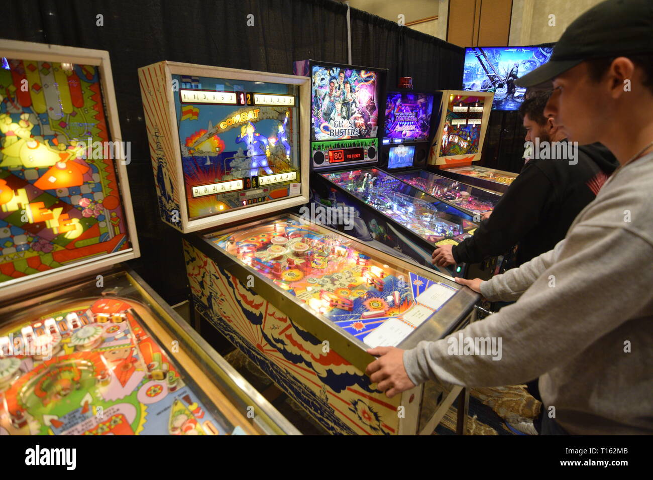 Frisco, USA. 23rd March, 2019. Pinball enthusiast playing the Combat