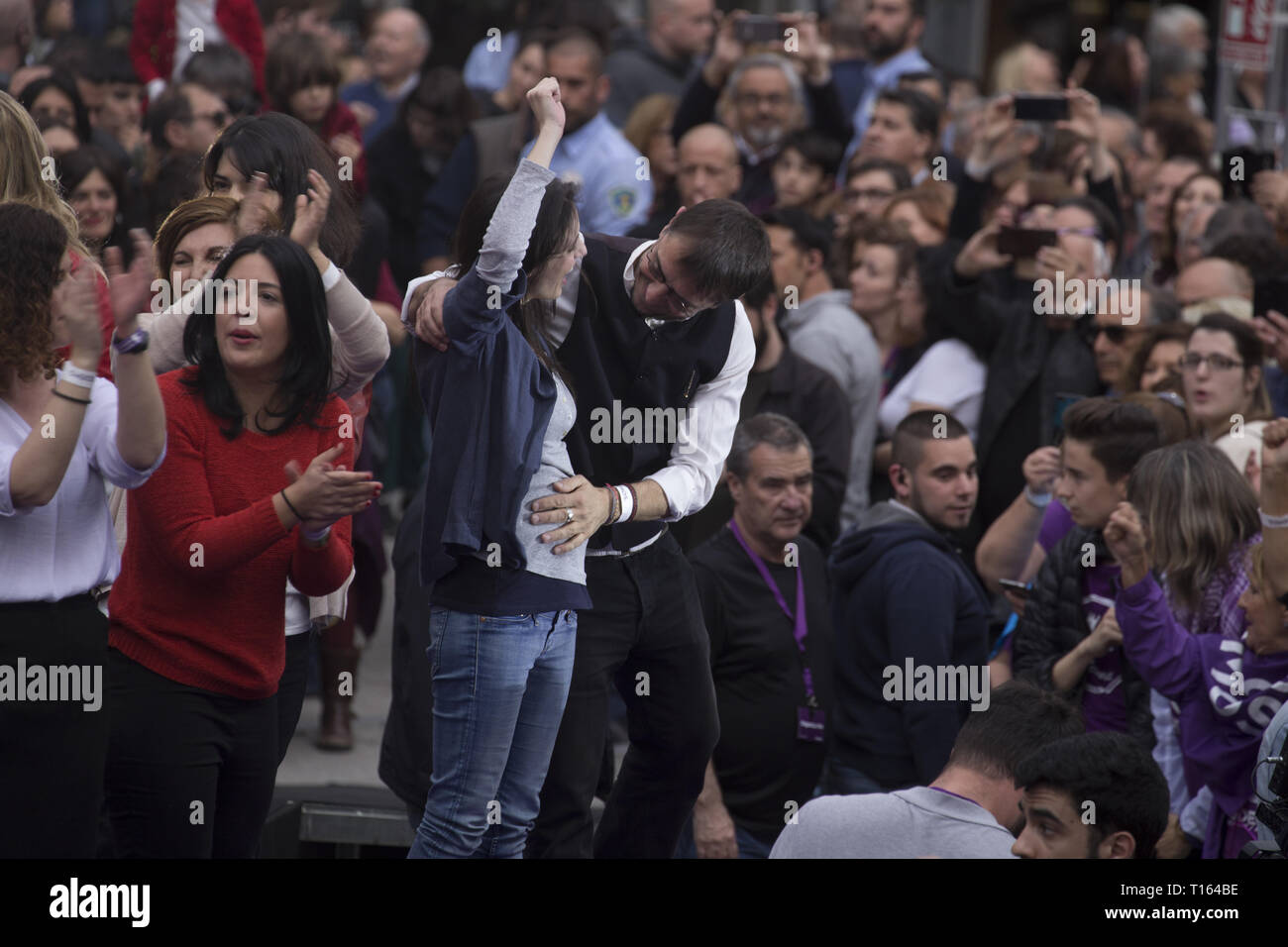 Madrid, Spain. 23rd Mar, 2019. Juan Carlos Monedero seen caressing the belly of pregnant Irene Montero during the rally.Hundreds of people gathered at the rally of Podemos ''He returns'' (Vuelve in Spanish) as an act of pre-election campaign after the return of the party leader, Pablo Iglesias. During the rally, different members of the Unidos Podemos group participated. Credit: Lito Lizana/SOPA Images/ZUMA Wire/Alamy Live News Stock Photo