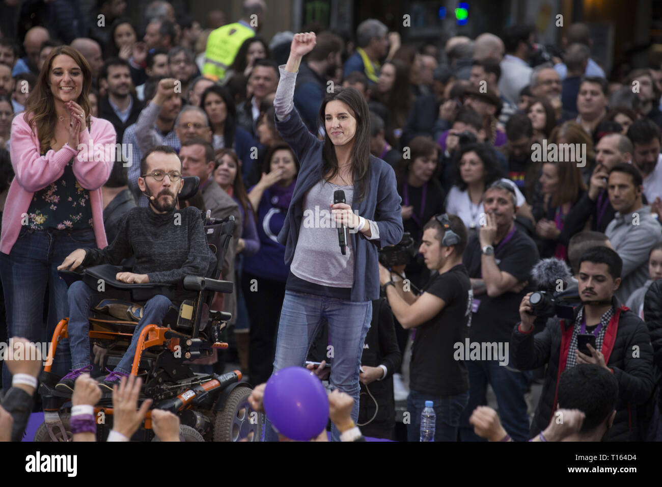 Madrid, Spain. 23rd Mar, 2019. Irene Montero seen raising her fist at the end of her speech during the rally.Hundreds of people gathered at the rally of Podemos ''He returns'' (Vuelve in Spanish) as an act of pre-election campaign after the return of the party leader, Pablo Iglesias. During the rally, different members of the Unidos Podemos group participated. Credit: Lito Lizana/SOPA Images/ZUMA Wire/Alamy Live News Stock Photo