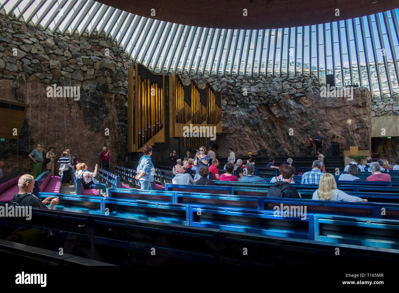 Interior view of the partially underground, rock-carved Temppeliaukio church in Helsinki, Finland. The Lutheran church has a natural appearance. Stock Photo