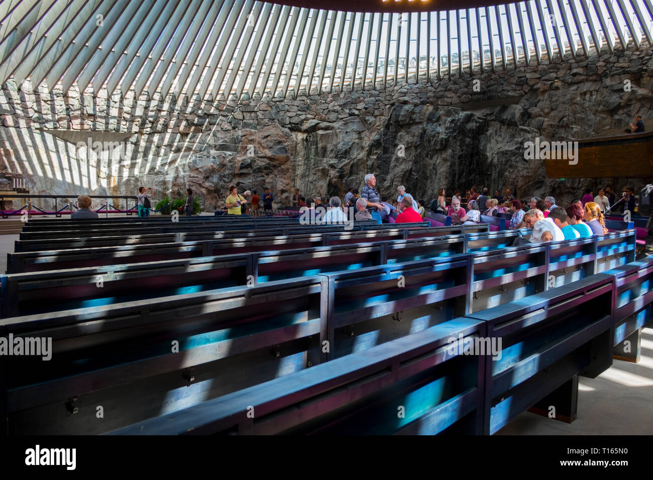 Interior view of the partially underground, rock-carved Temppeliaukio church in Helsinki, Finland. The Lutheran church has a natural appearance. Stock Photo