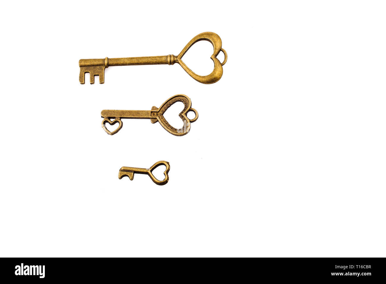 Heart shaped retro metal keys on white background Stock Photo - Alamy