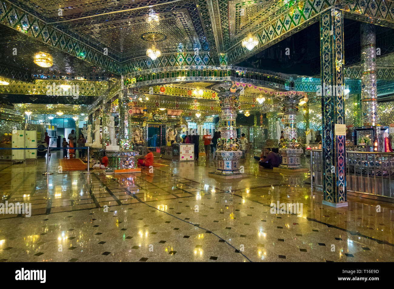 The unique Arulmigu Sri Rajakaliamman Glass Temple in Johor Bahru,  Malaysia. The interior is completely covered in glass tiles. Interior and  praying Stock Photo - Alamy