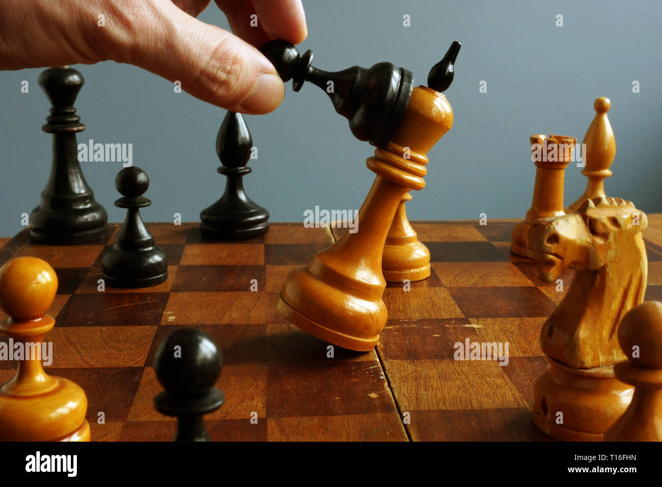 Success in business and confrontation in competition. Black pawn wins king. Stock Photo