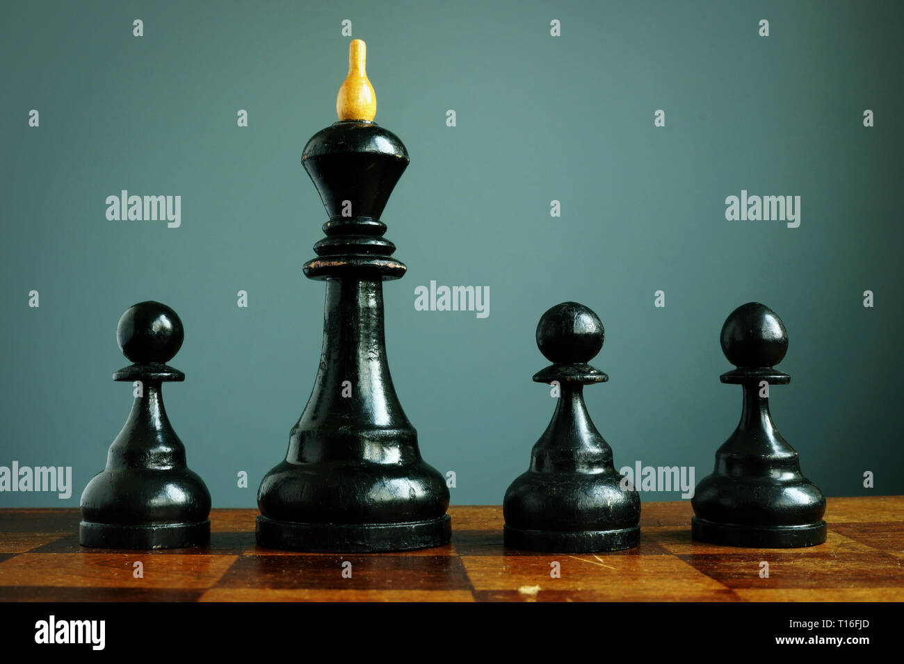 Competitive edge or business advantage in recruitment. Pawns and chess king. Stock Photo