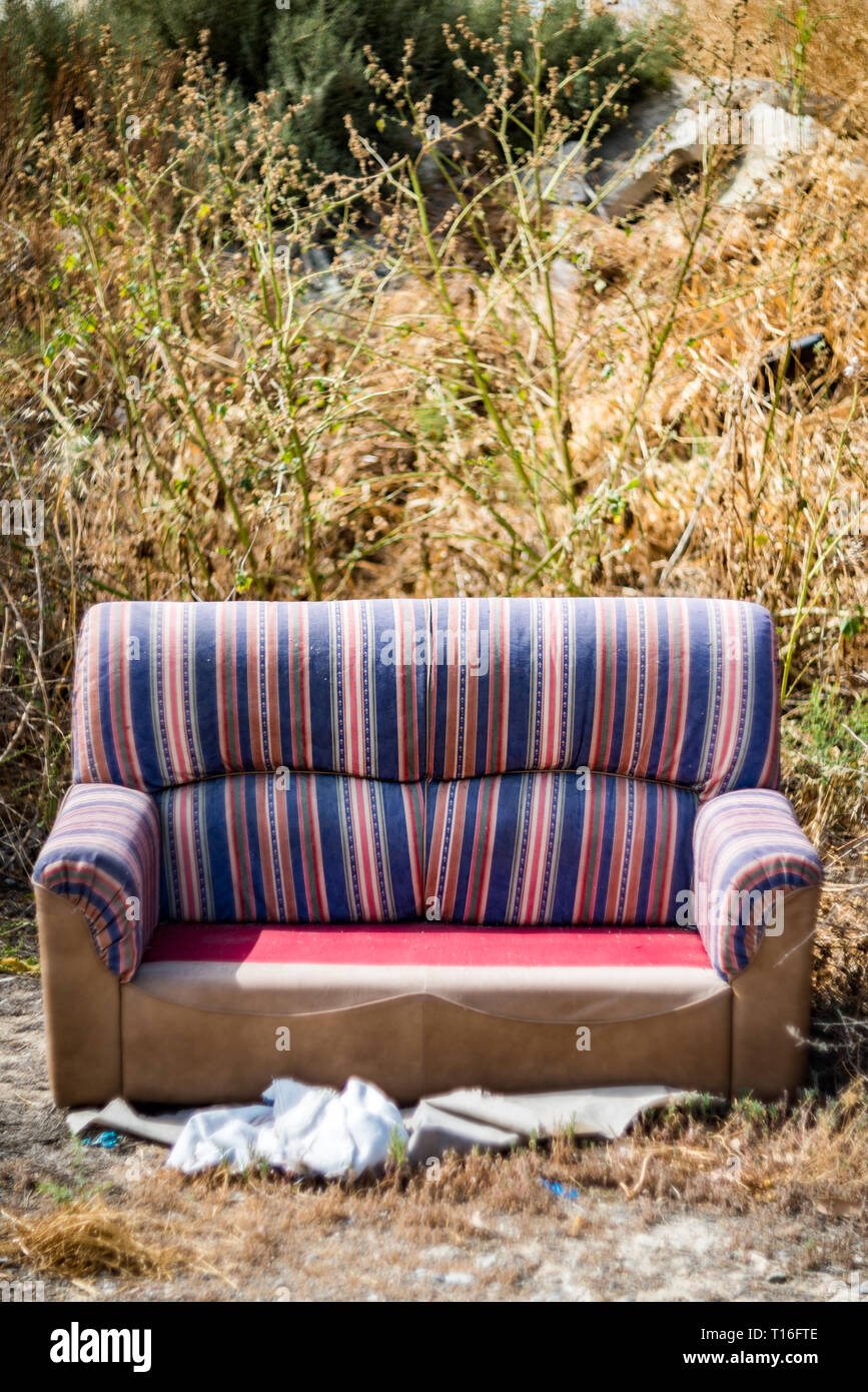 https://c8.alamy.com/comp/T16FTE/sofa-thrown-away-in-natural-area-forest-part-illegal-dumping-trash-in-nature-ecology-T16FTE.jpg