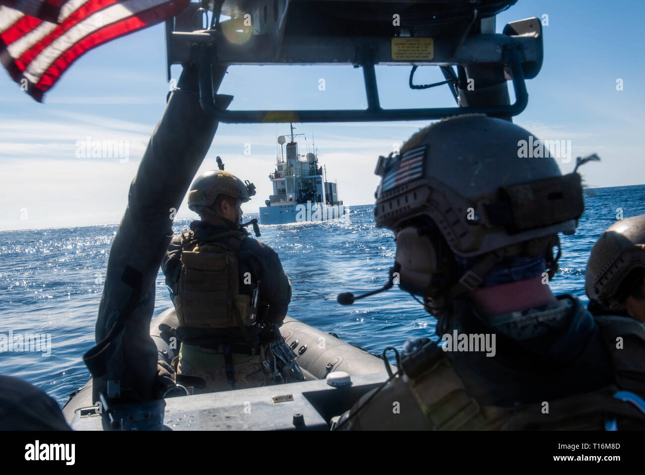 190322-N-HD110-0443  PACIFIC OCEAN (March 22, 2019) Sailors assigned to Assault Craft Unit (ACU) 1 observe motor vessel MV ATLS-9701 during a visit, board, search, and seizure (VBSS) exercise conducted by VBSS team attached to the Harpers Ferry-class amphibious dock landing ship USS Harpers Ferry (LSD 49). Harpers Ferry is underway conducting routine operations as a part of USS Boxer Amphibious Ready Group (ARG) in the eastern Pacific Ocean. (U.S. Navy photo by Mass Communication Specialist 3rd Class Danielle A. Baker) Stock Photo