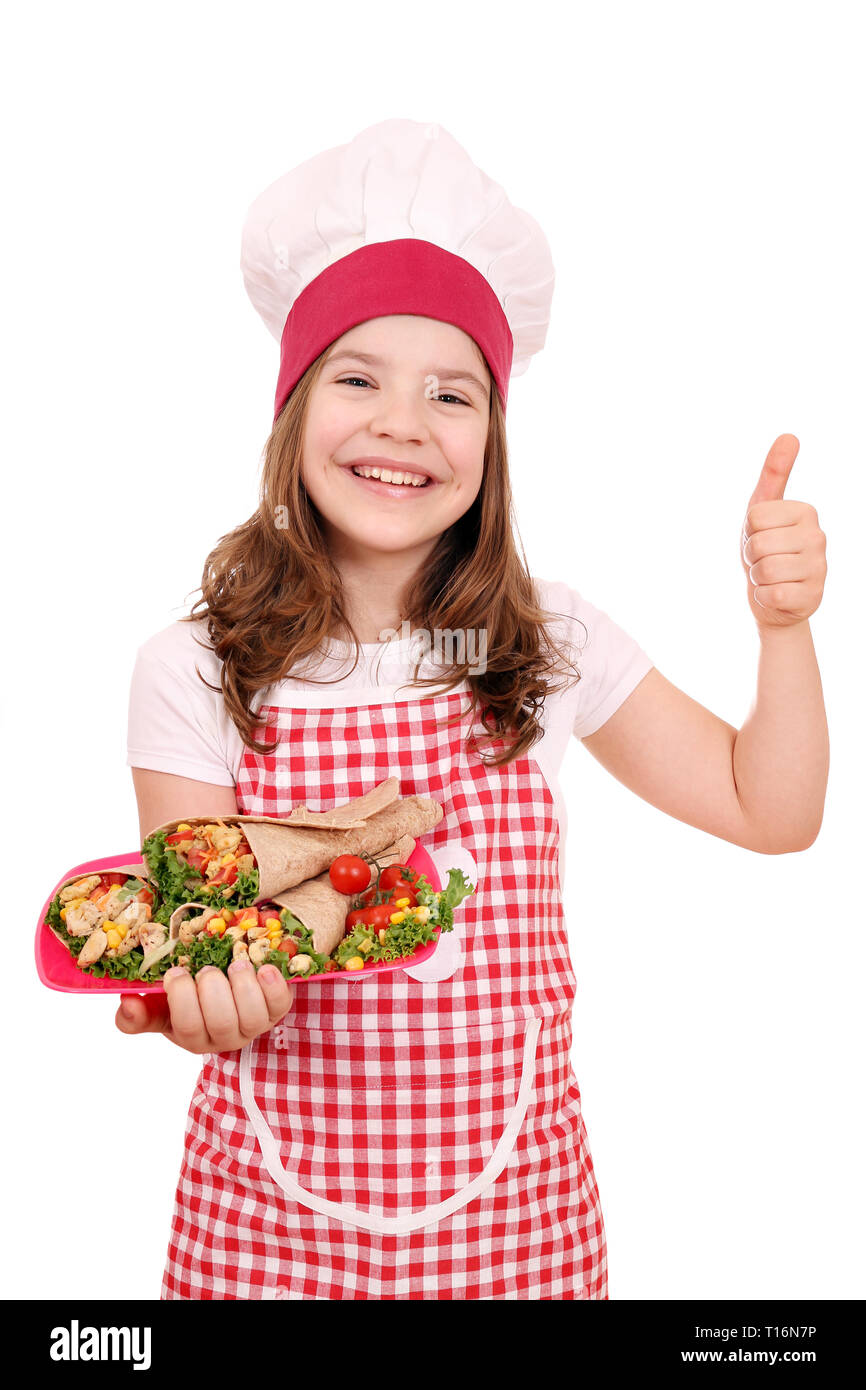 Happy little girl cook with burritos mexican food and thumb up Stock Photo