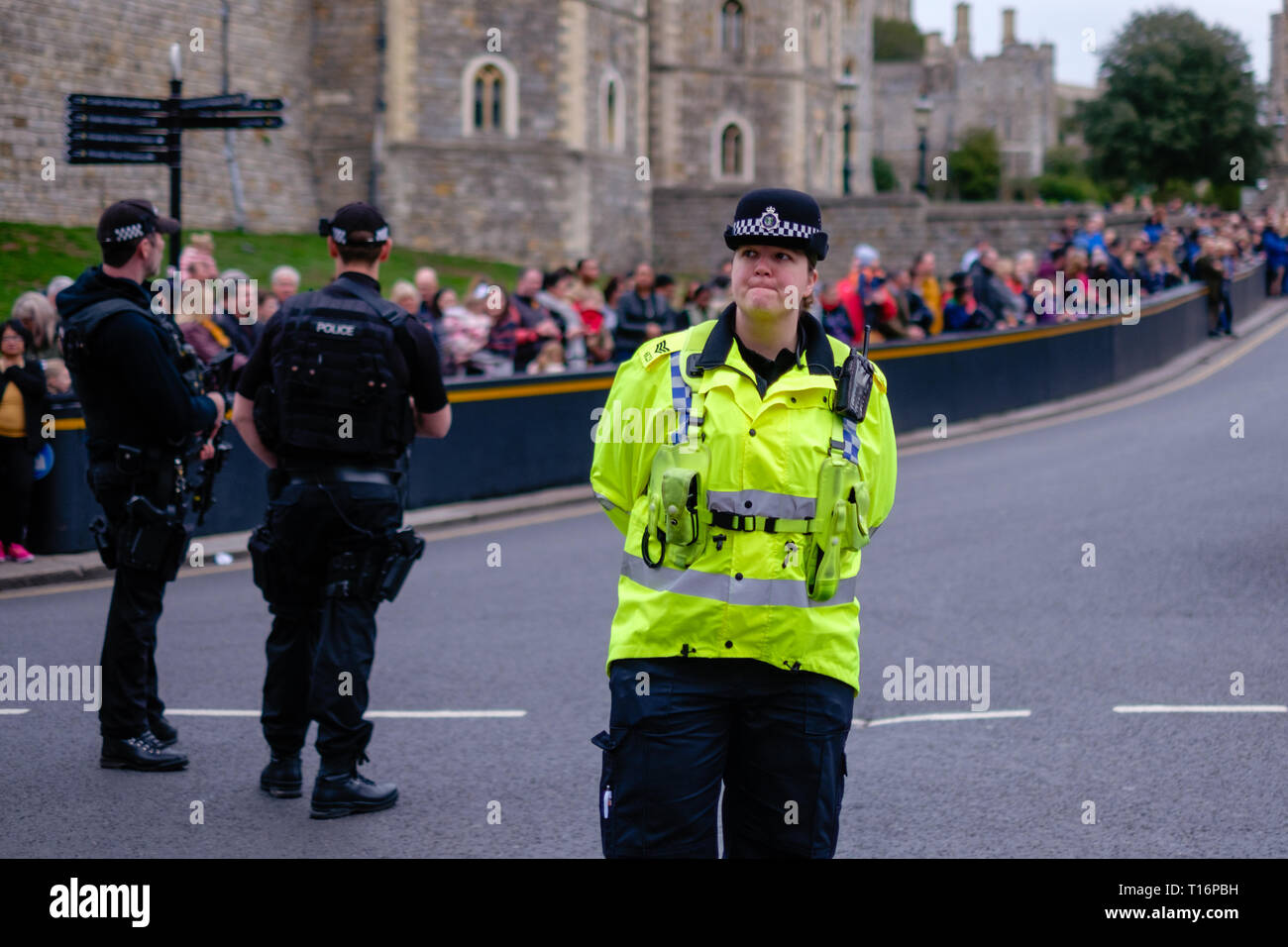 A policewoman on duty outside Windsor Castle, UK Stock Photo