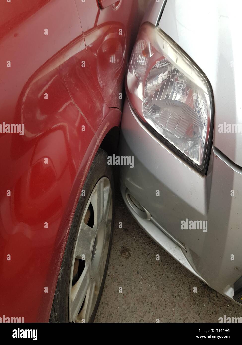 traffic accident in the city on the road. two cars stand touching