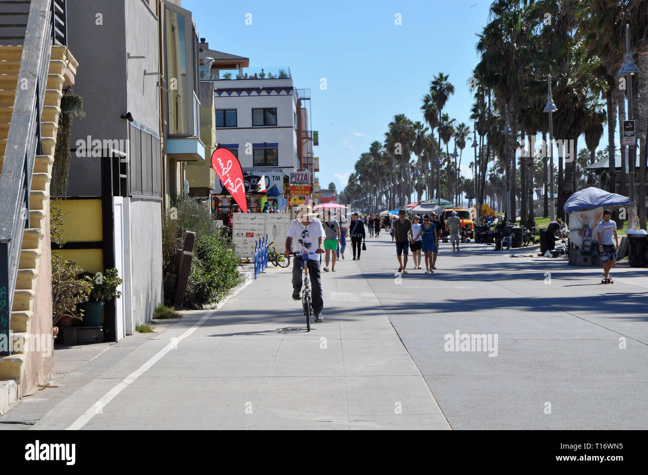 Los Angeles, U.S.A. - November 3 2015: People walking along the shops of Venice Beach. Stock Photo