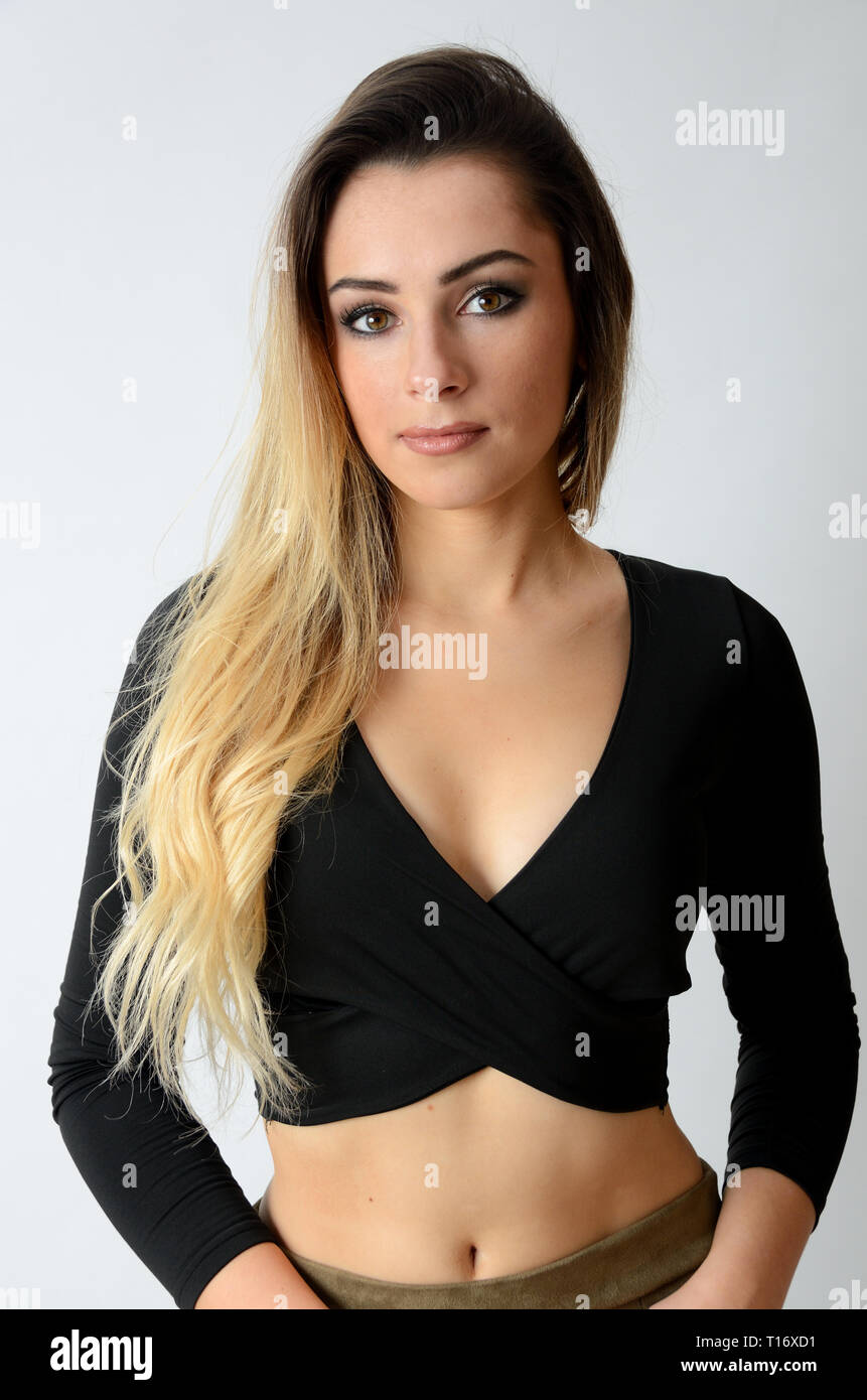 Portrait of beautiful girl from Poland. Young, blonde female with black top and cleavage. Stock Photo