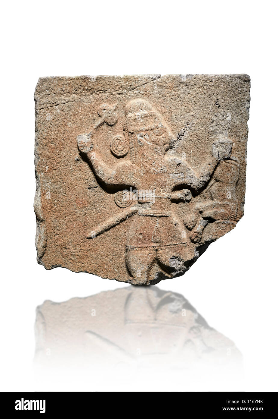 Hittite monumental relief sculpture of a man with an axe in one hand about to use it to kill a lion he is holding updide down in his other hand. Late  Stock Photo