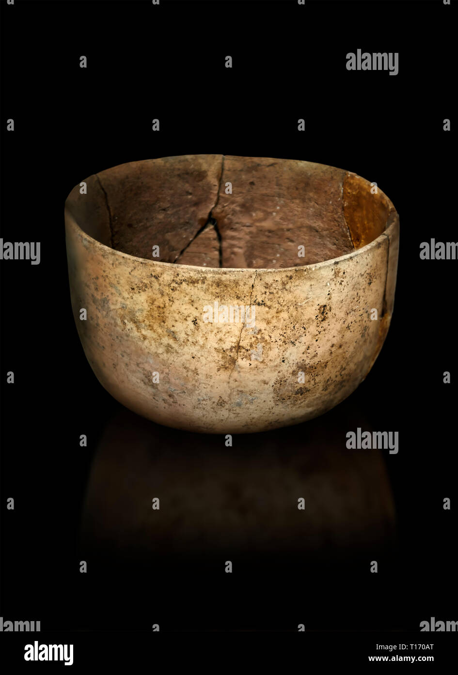 Neolithic terracotta bowl. Catalhoyuk collection, Konya Archaeological Museum, Turkey. Against a black background Stock Photo